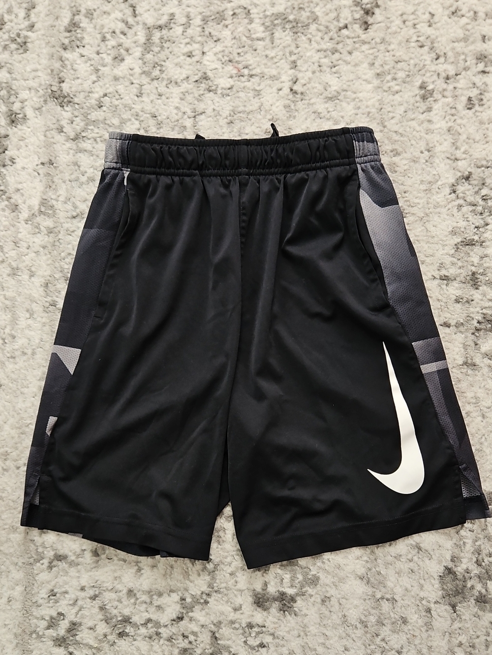 Nike Boy's Black Athletic Shorts with Large White Swoosh and Gray Side Panels